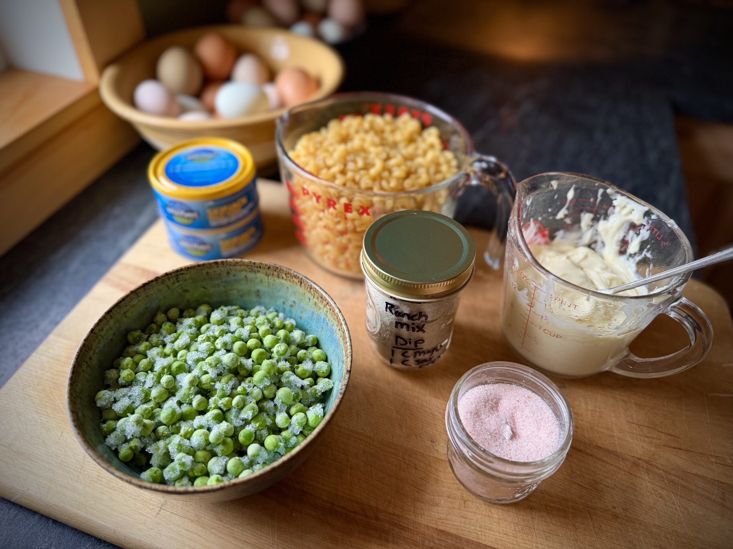frozen garden peas in bowl for tuna macaroni salad