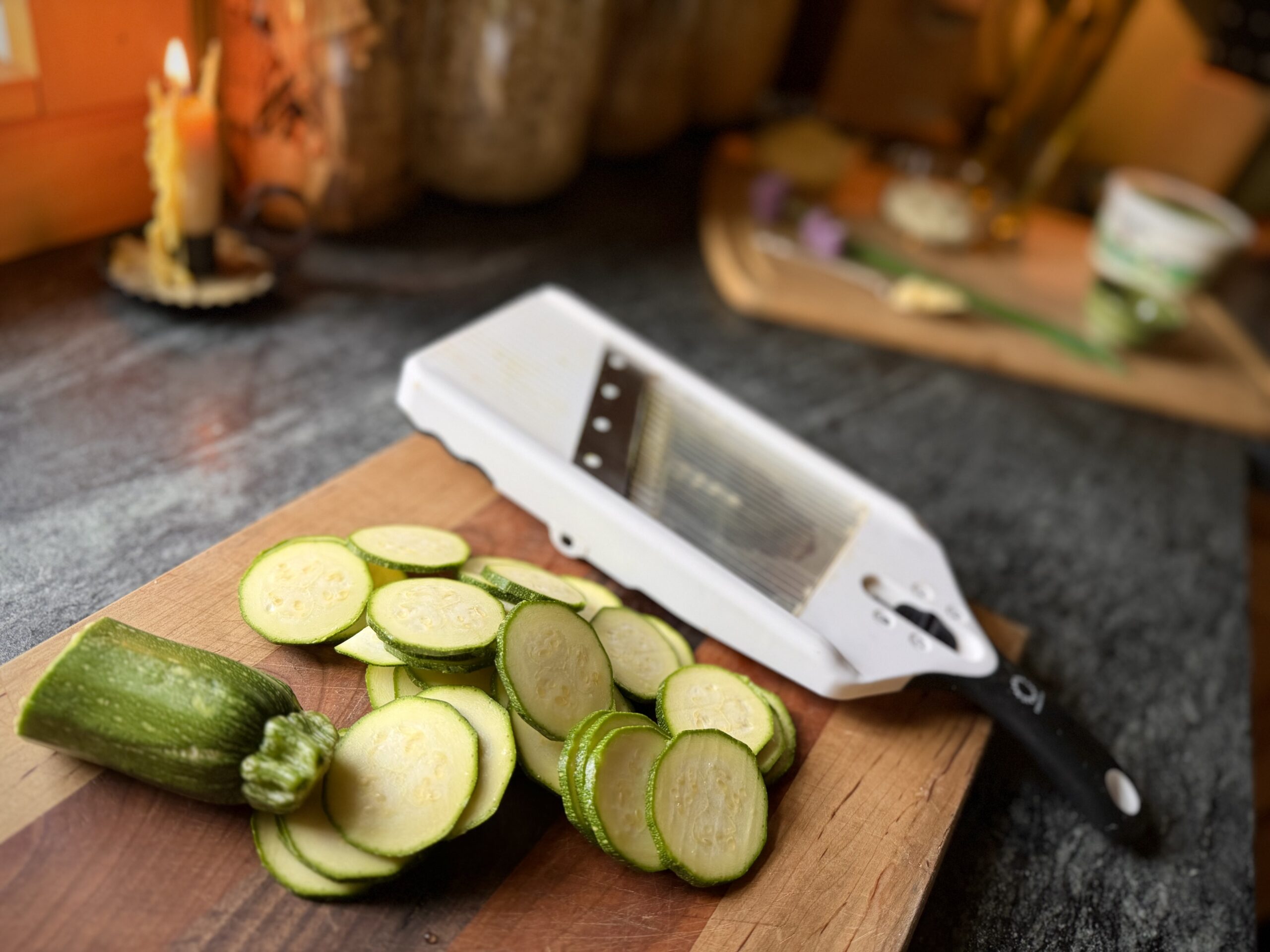 Zucchini sliced into thin rounds with a mandoline slicer for homemade zucchini galette.
