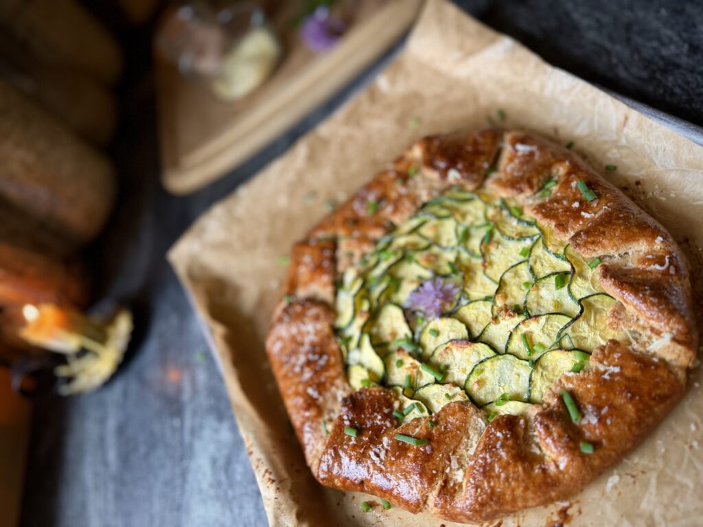 Rustic zucchini galette with ricotta cheese and fresh garden zucchini baked in a golden homemade crust.