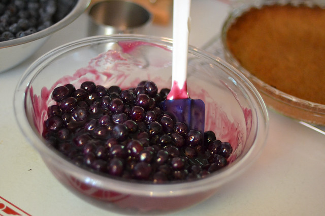 Fresh blueberries folded into homemade blueberry glaze before filling a graham cracker pie crust.