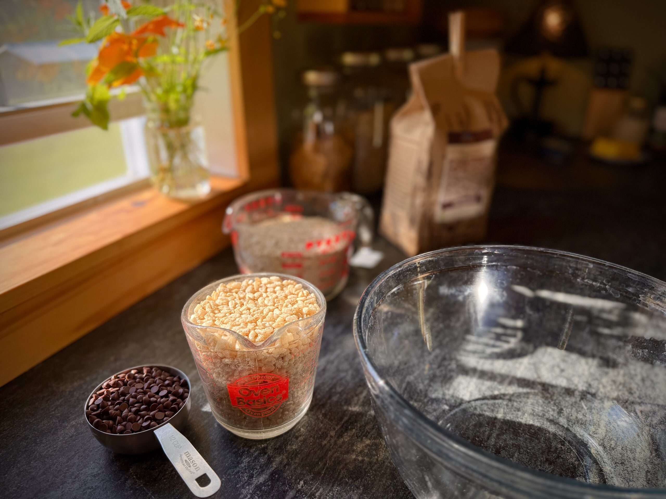 Crispy rice cereal and mini chocolate chips measured for homemade chewy chocolate chip granola bars.
