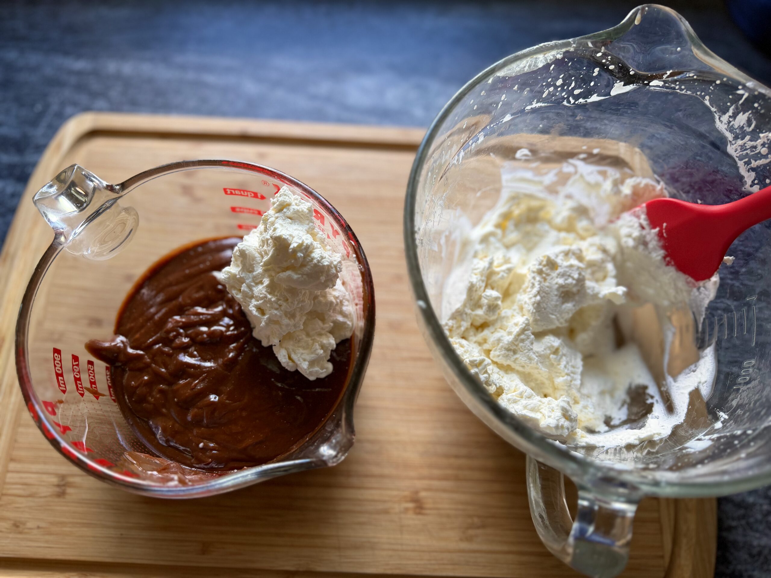 A small amount of whipped cream folded into chocolate custard to lighten the mixture before adding the remaining cream.