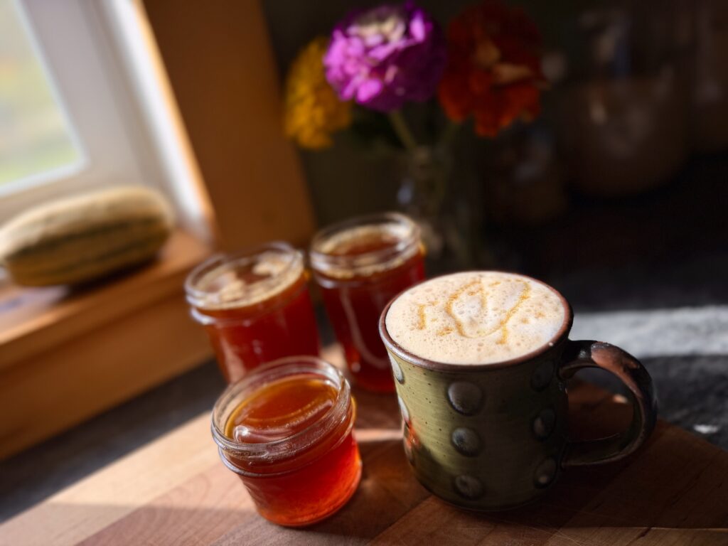 Pumpkin spice maple syrup served with a creamy fall coffee