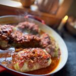 Old fashioned stuffed cabbage rolls with ground beef and rice in homemade tomato sauce