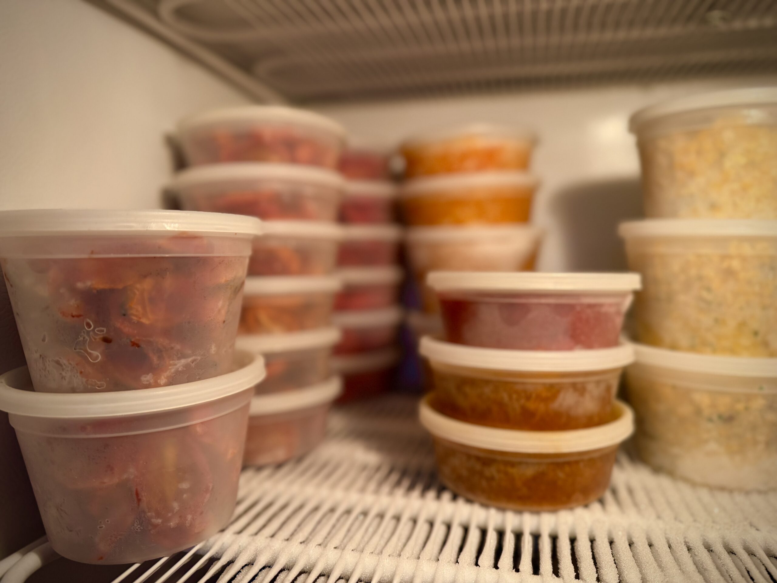 Freezer containers in the freezer filled with the harvest.